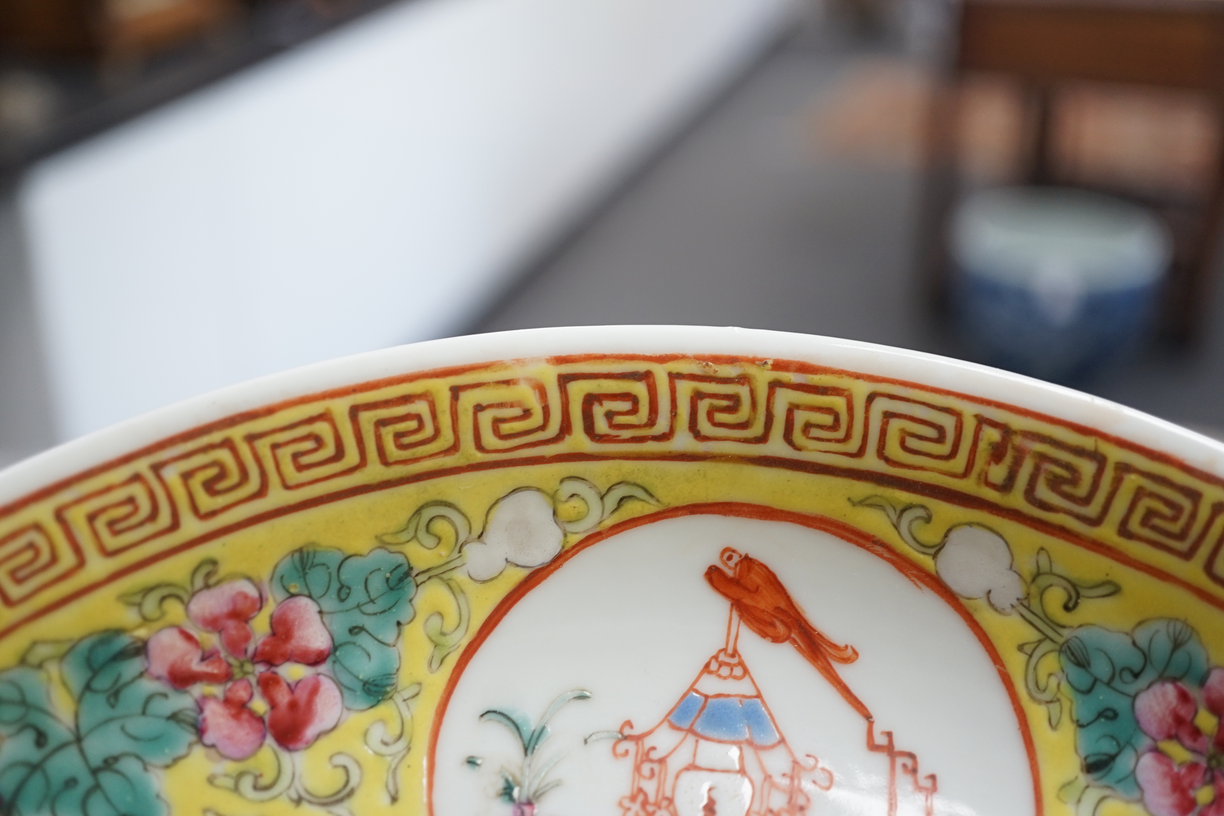 A pair of Chinese yellow ground medallion saucer dishes, Guangxu six character marks, early 20th century, hairline crack to one dish